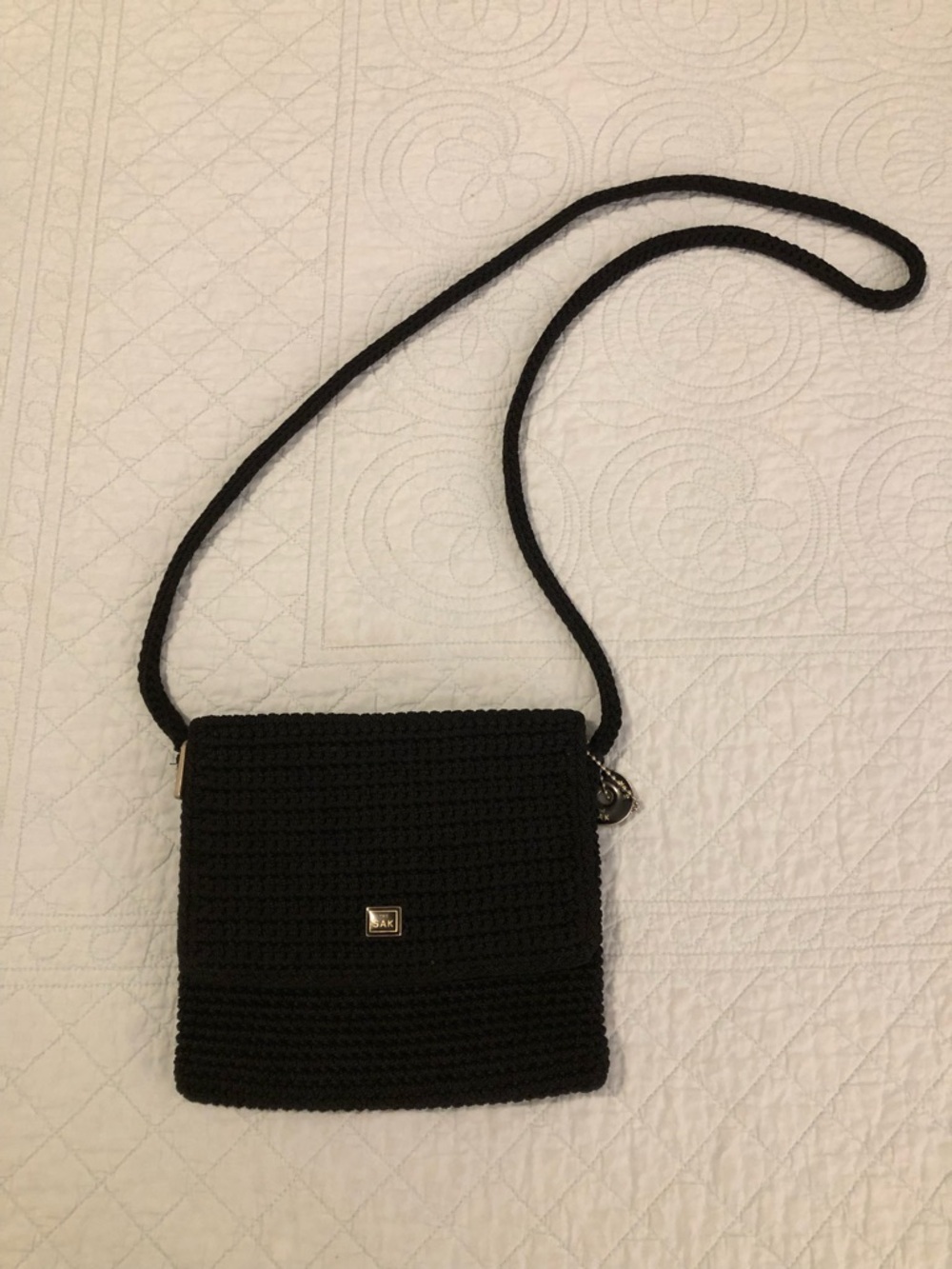 The Sak black crochet mini crossbody bag.